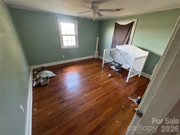 a living room with furniture and a chair