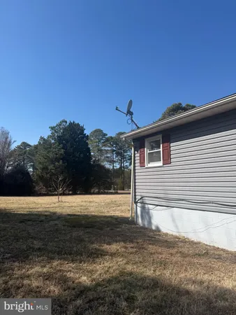 a view of a door with a door and wooden floor