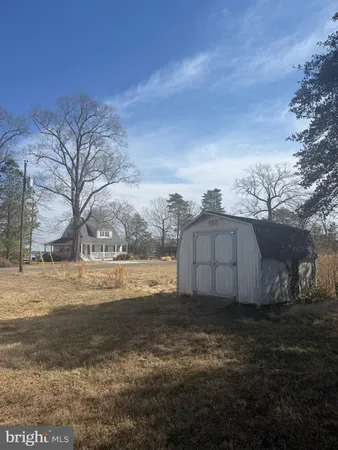a view of a backyard with a fence