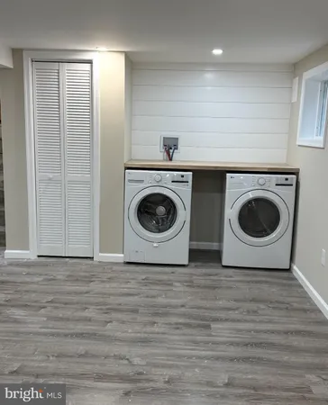 a view of a kitchen with a washer and dryer