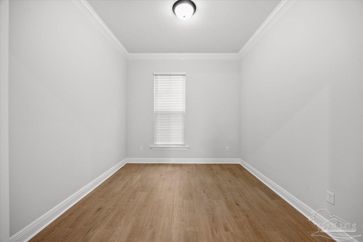 5362 Adeline Circle Pace, FL 32571 - Photo 15 of 40 a view of empty room with wooden floor