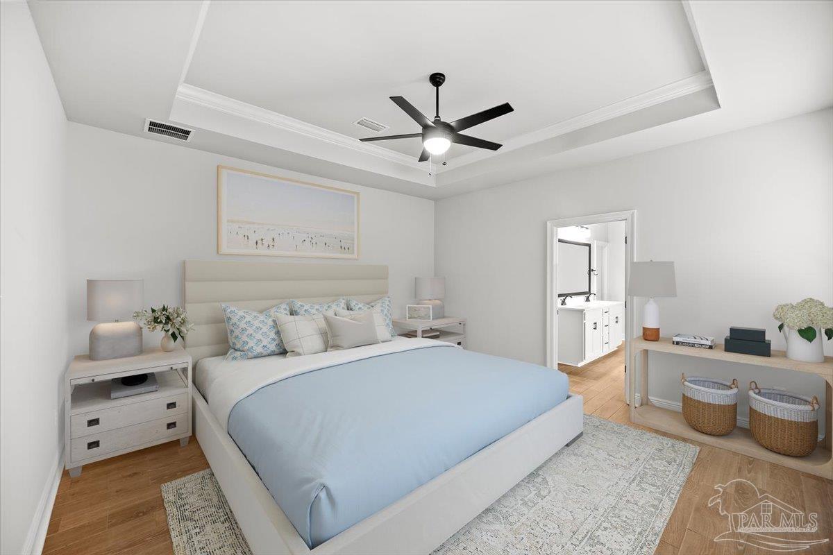 5362 Adeline Circle Pace, FL 32571 - Photo 21 of 40 a spacious bedroom with a bed and a chandelier