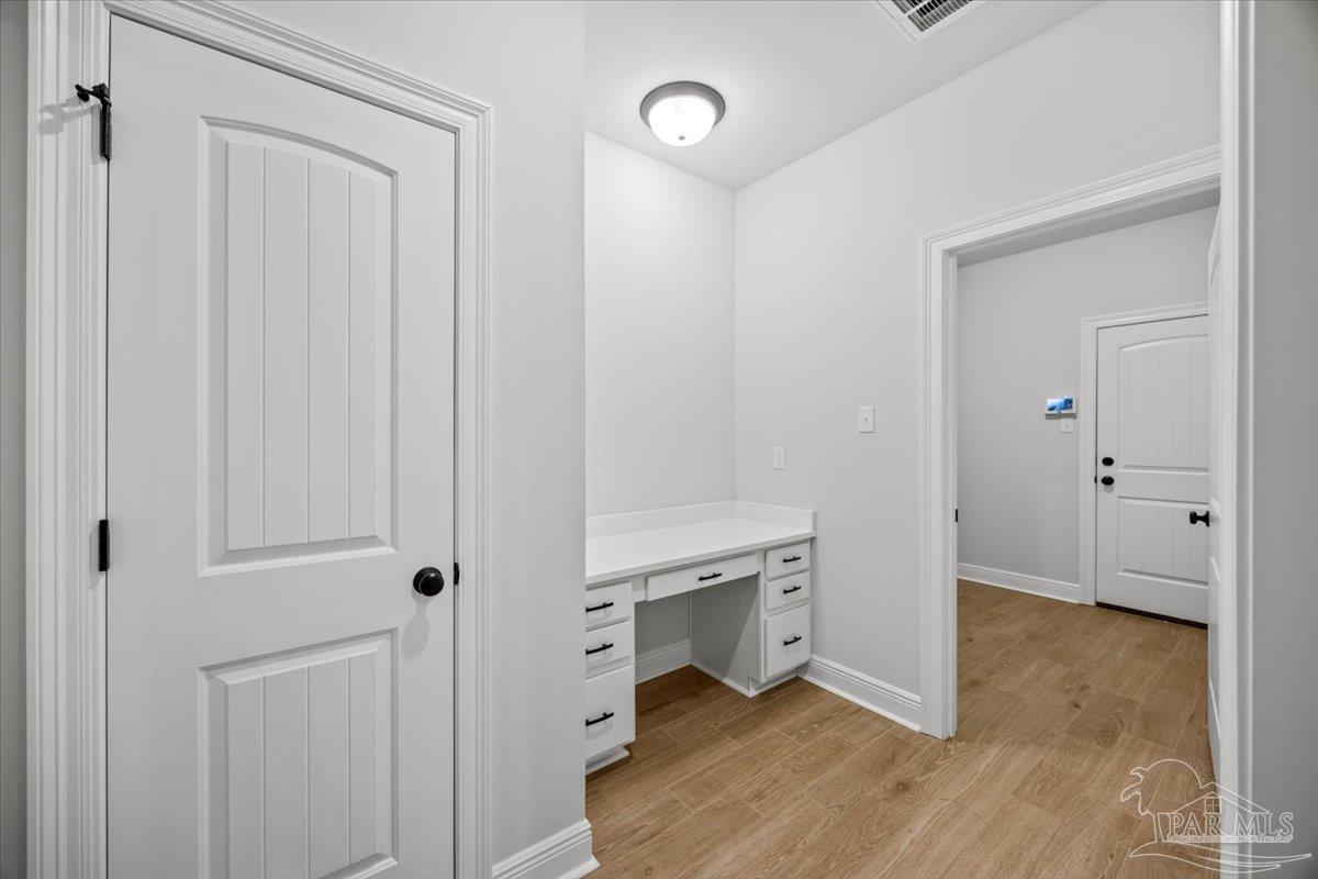 5362 Adeline Circle Pace, FL 32571 - Photo 27 of 40 a room with white cabinets and entryway