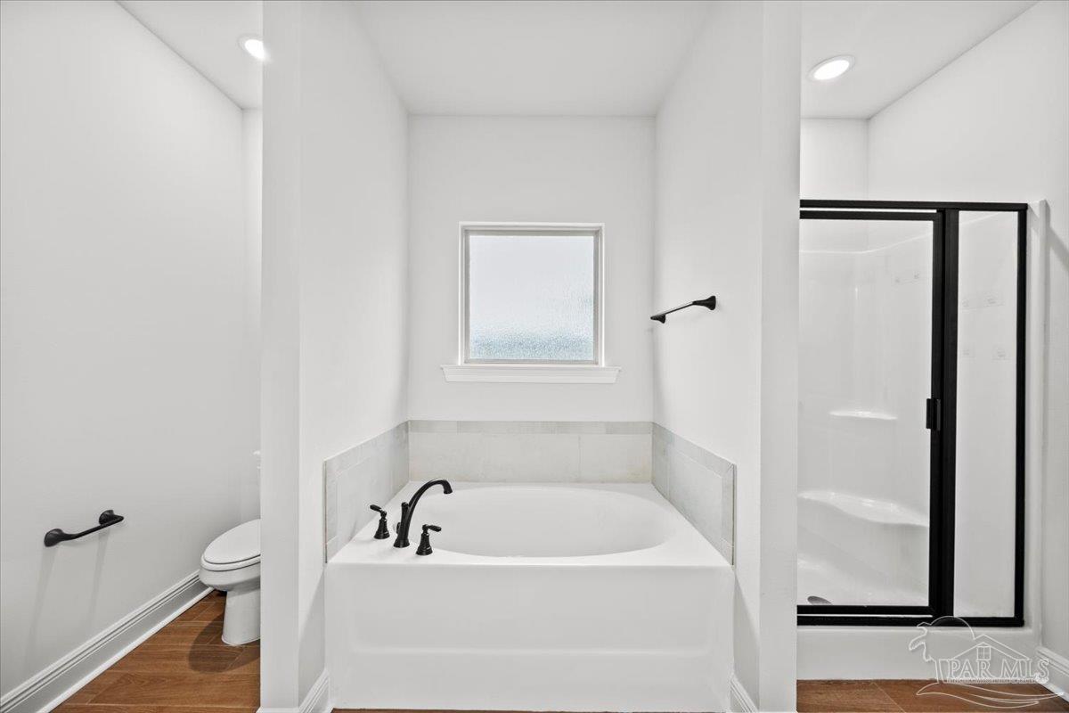 5362 Adeline Circle Pace, FL 32571 - Photo 28 of 40 a bathroom with a tub and a sink