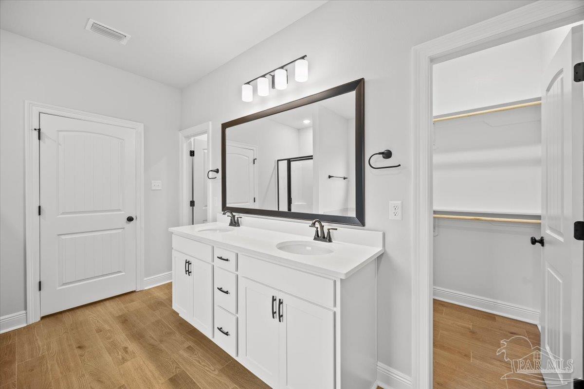 5362 Adeline Circle Pace, FL 32571 - Photo 29 of 40 a spacious bathroom with a double vanity sink mirror and