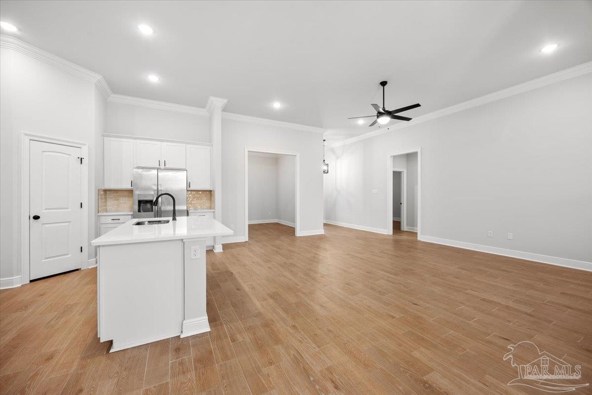 5362 Adeline Circle Pace, FL 32571 - Photo 5 of 40 a view of kitchen with stainless steel appliances refrigerator stove and wooden floor