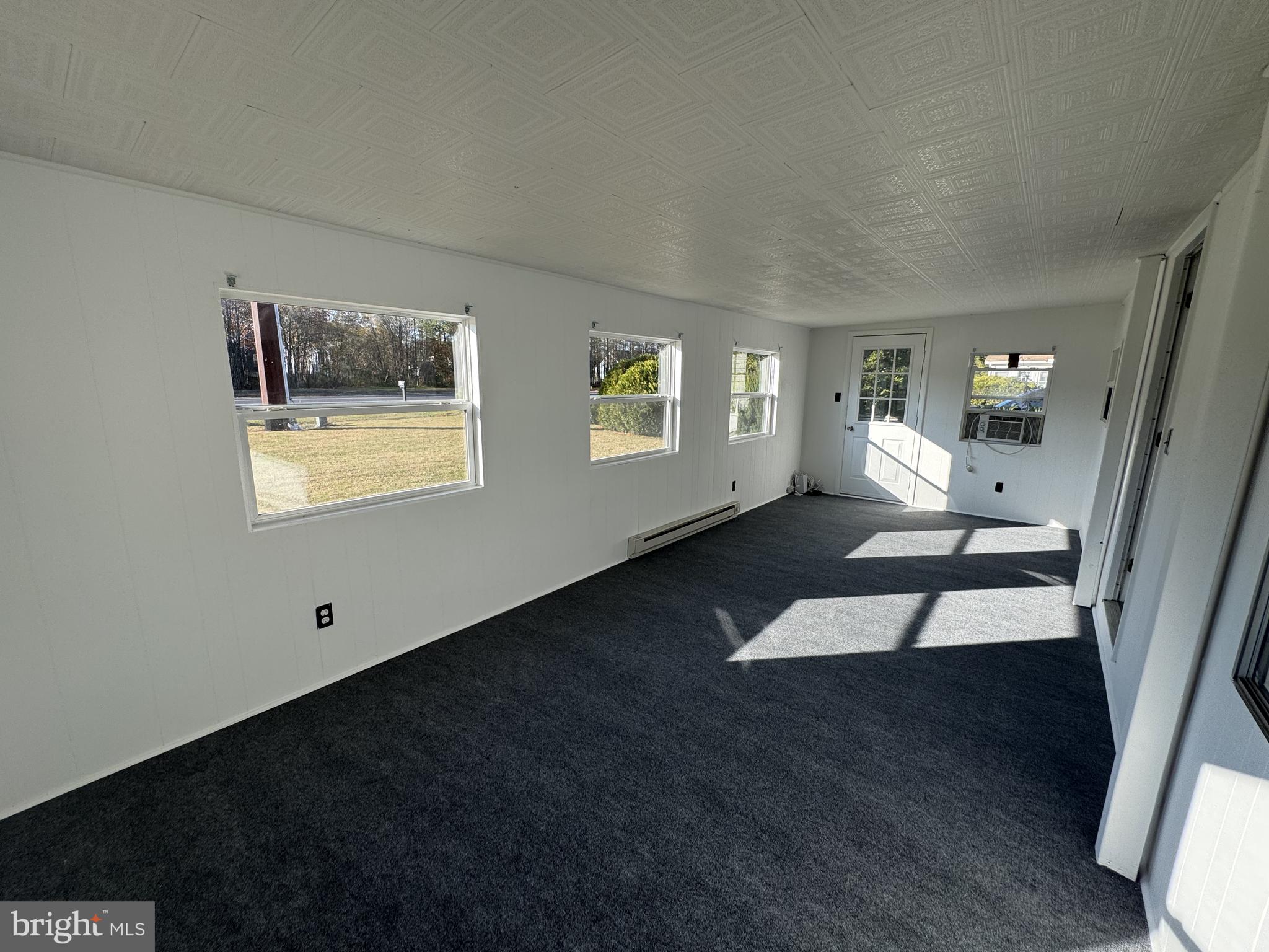 28659 Harmons Hill Road Millsboro, DE 19966 - Photo 14 of 16 a living room with furniture and a wooden floor