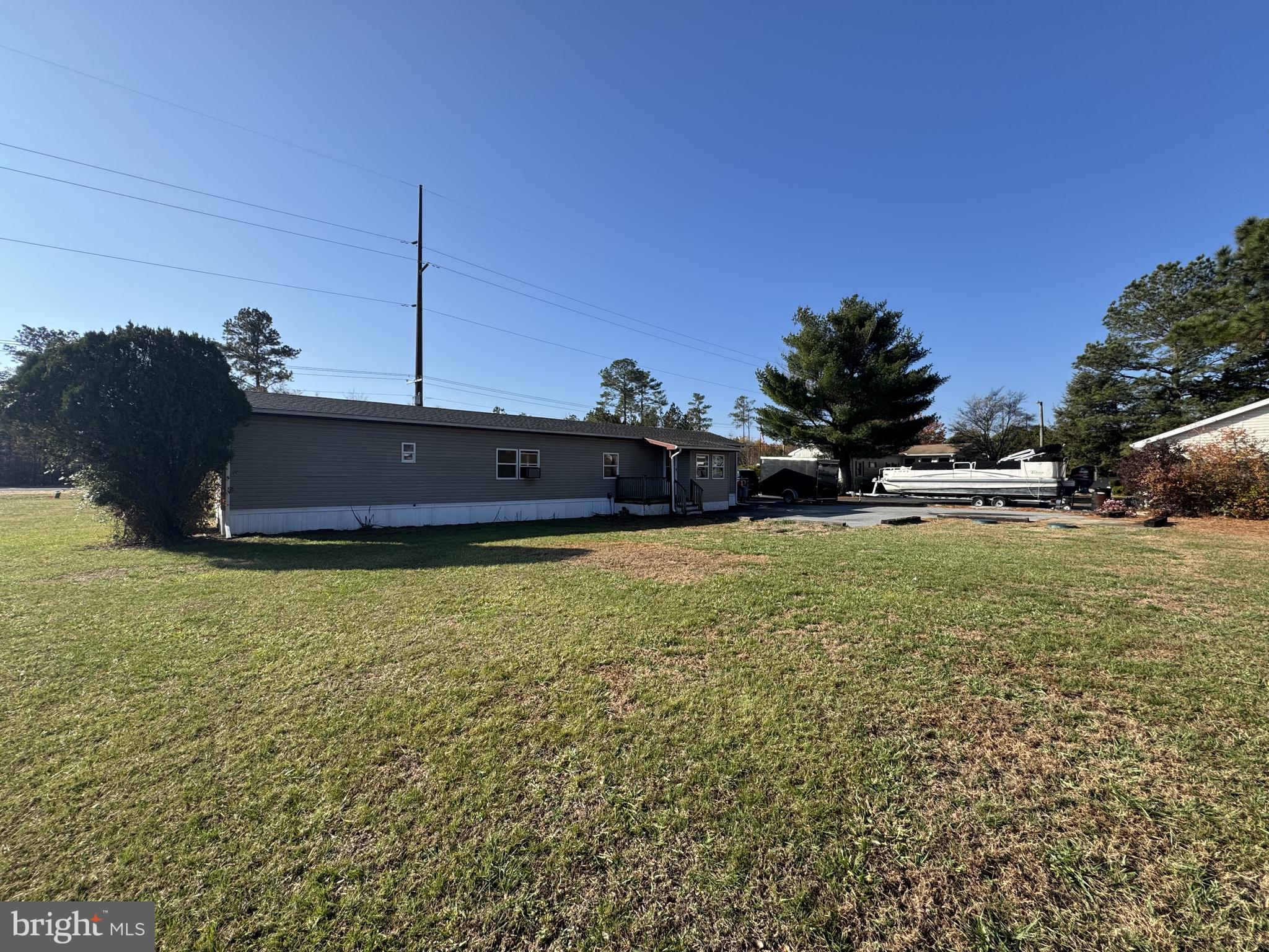 28659 Harmons Hill Road Millsboro, DE 19966 - Photo 15 of 16 a front view of a house with a yard