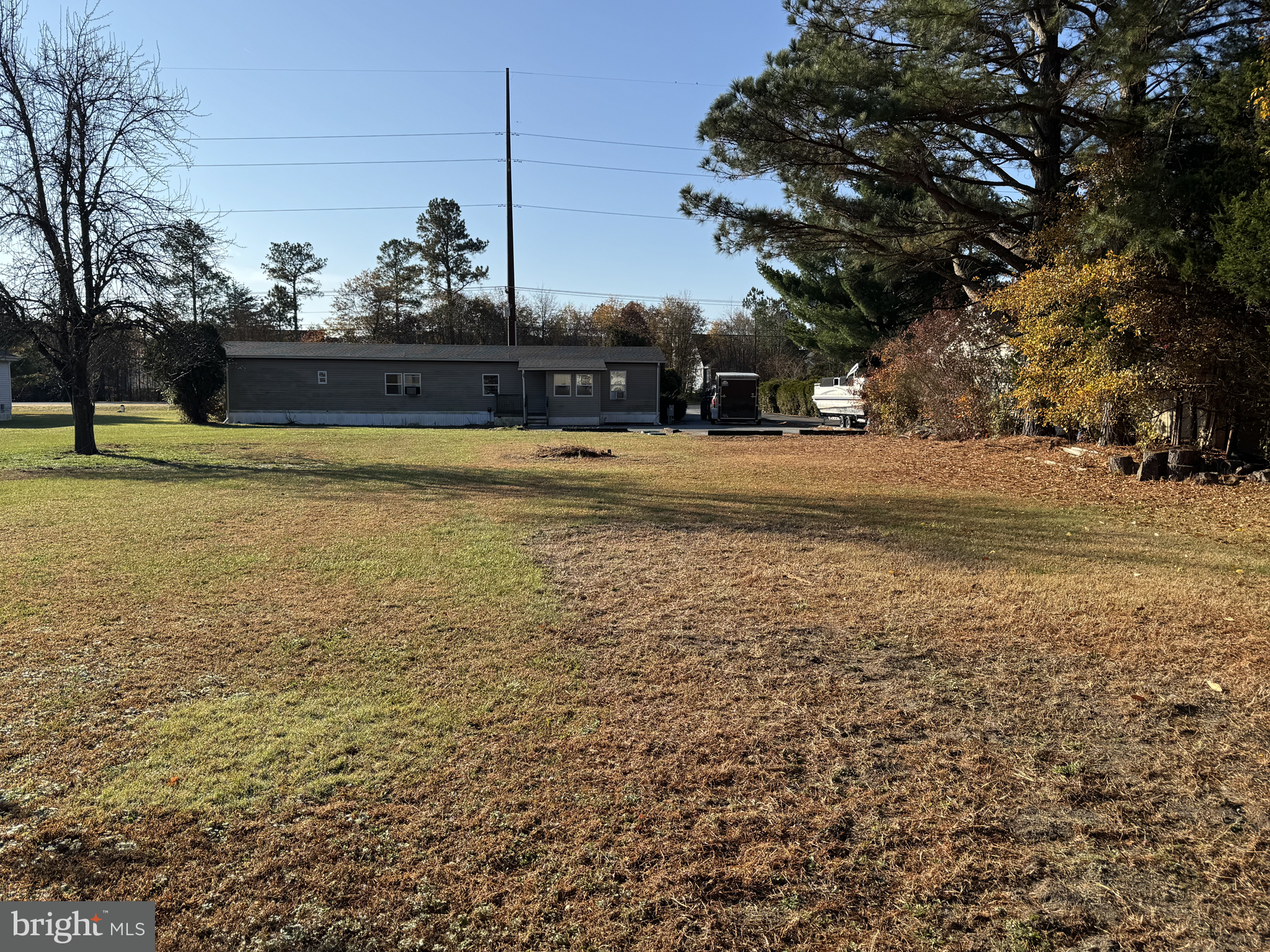 28659 Harmons Hill Road Millsboro, DE 19966 - Photo 2 of 16 a view of a lake with a house