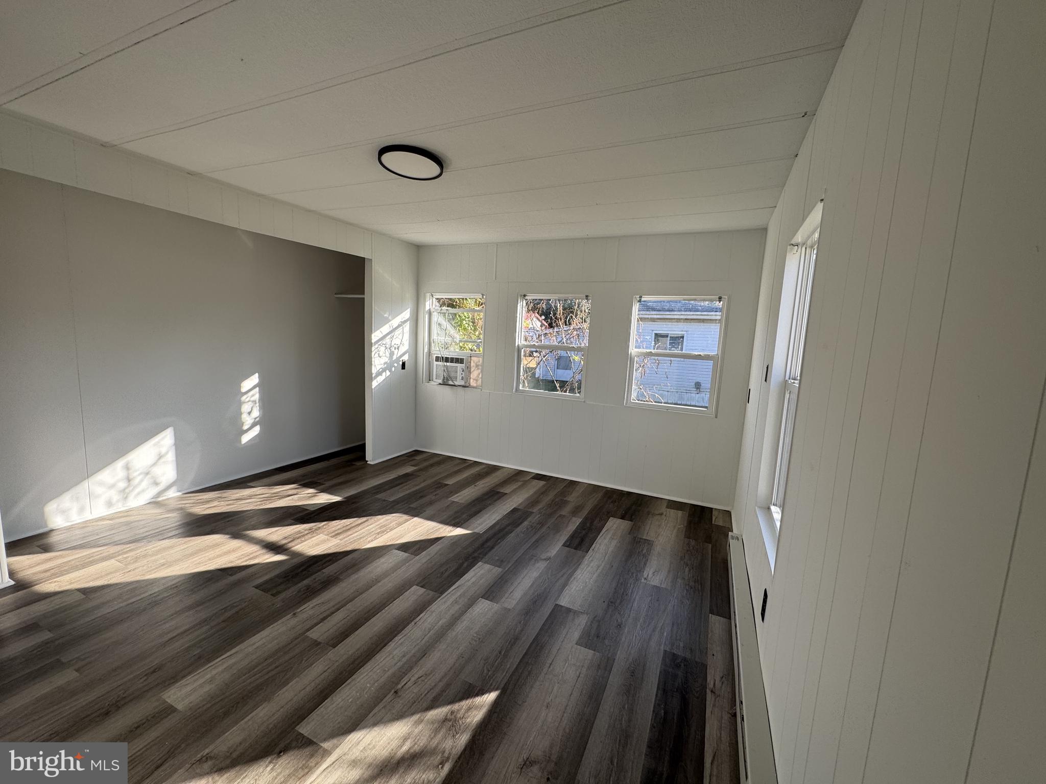 28659 Harmons Hill Road Millsboro, DE 19966 - Photo 10 of 16 a view of empty room with wooden floor