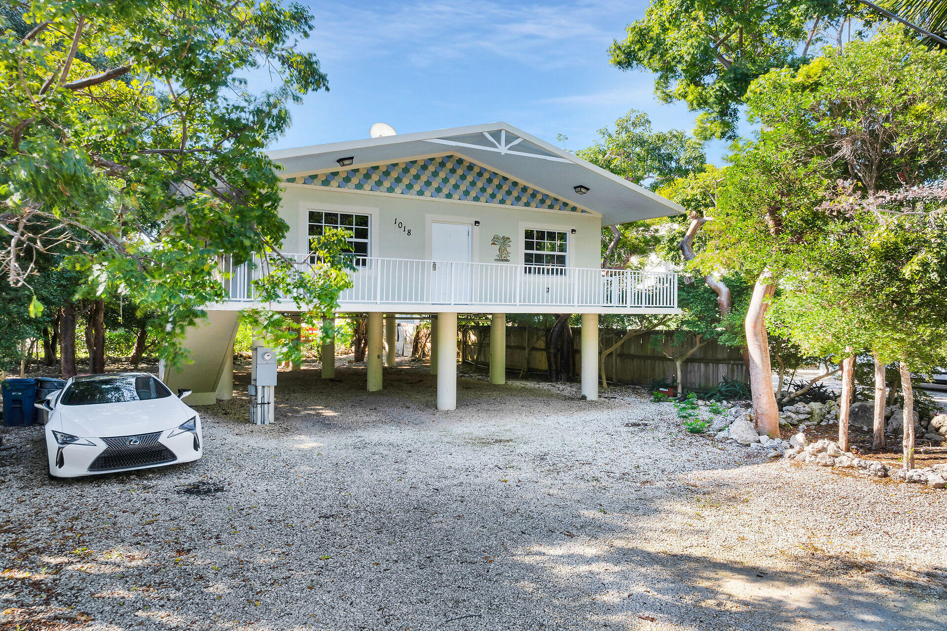 a view of a house with a yard porch and sitting area