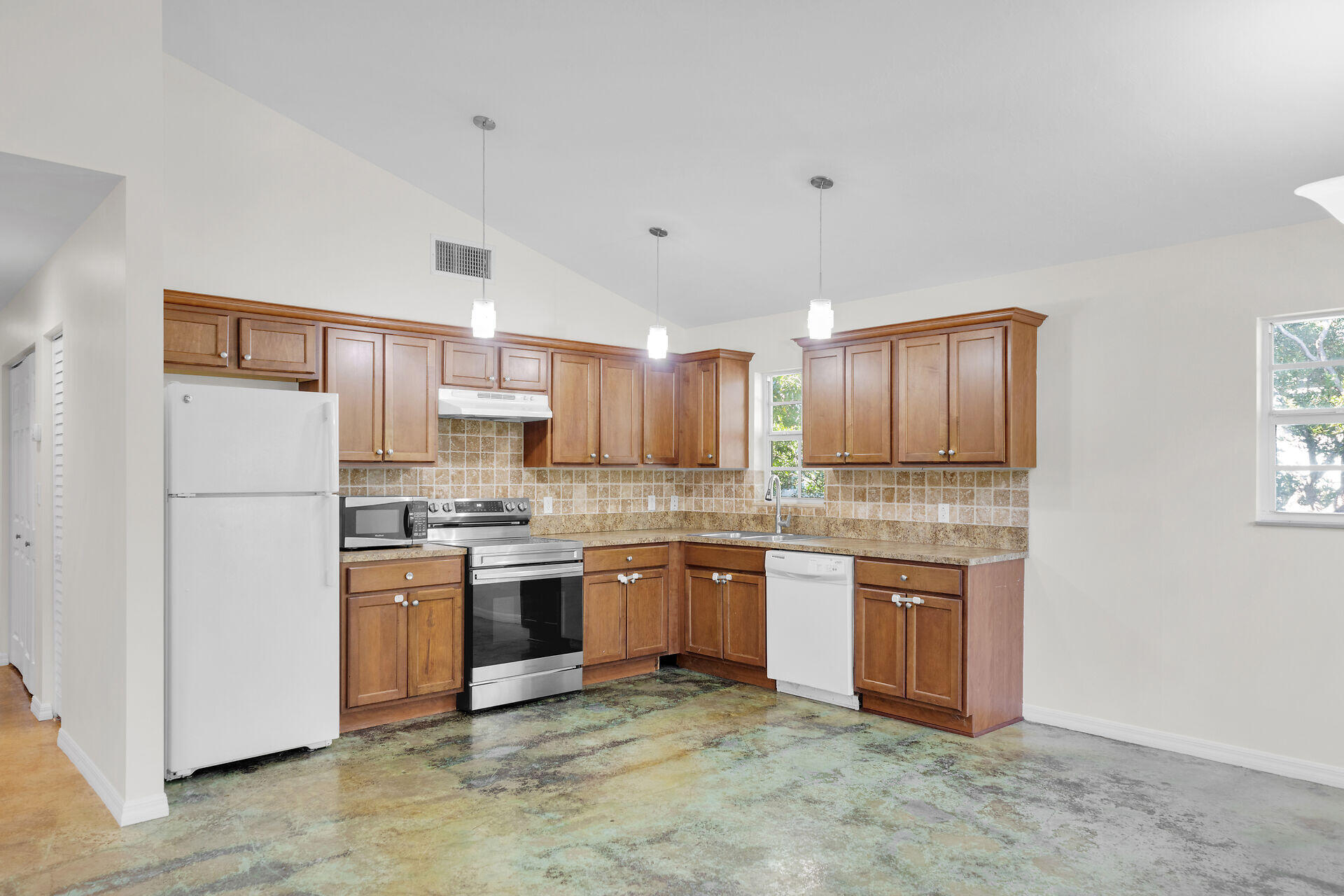 1018 Snapper Lane Key Largo, FL 33037 - Photo 11 of 24 a kitchen with stainless steel appliances granite countertop a stove sink and cabinets