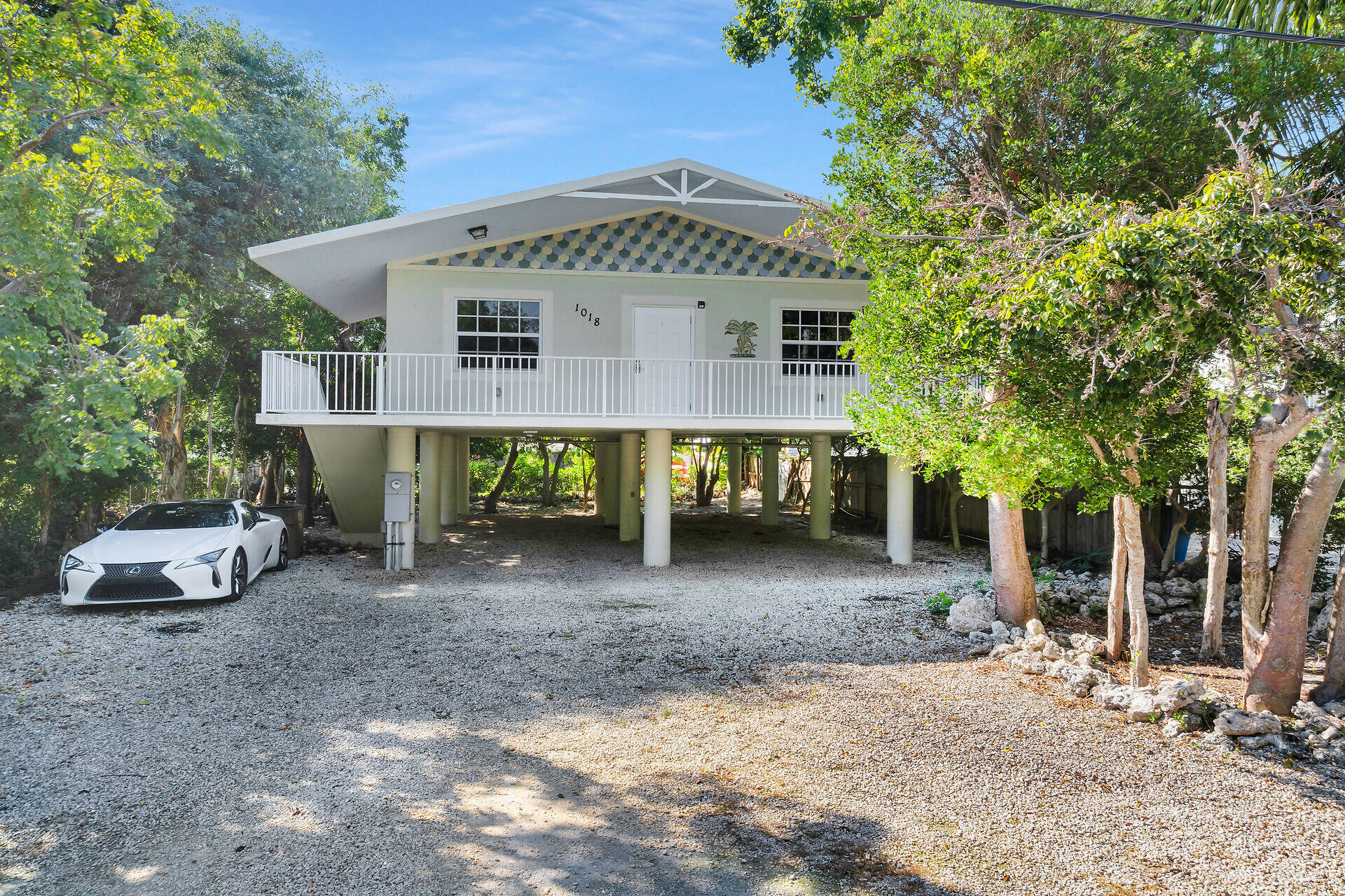 1018 Snapper Lane Key Largo, FL 33037 - Photo 12 of 24 a view of a house with a patio