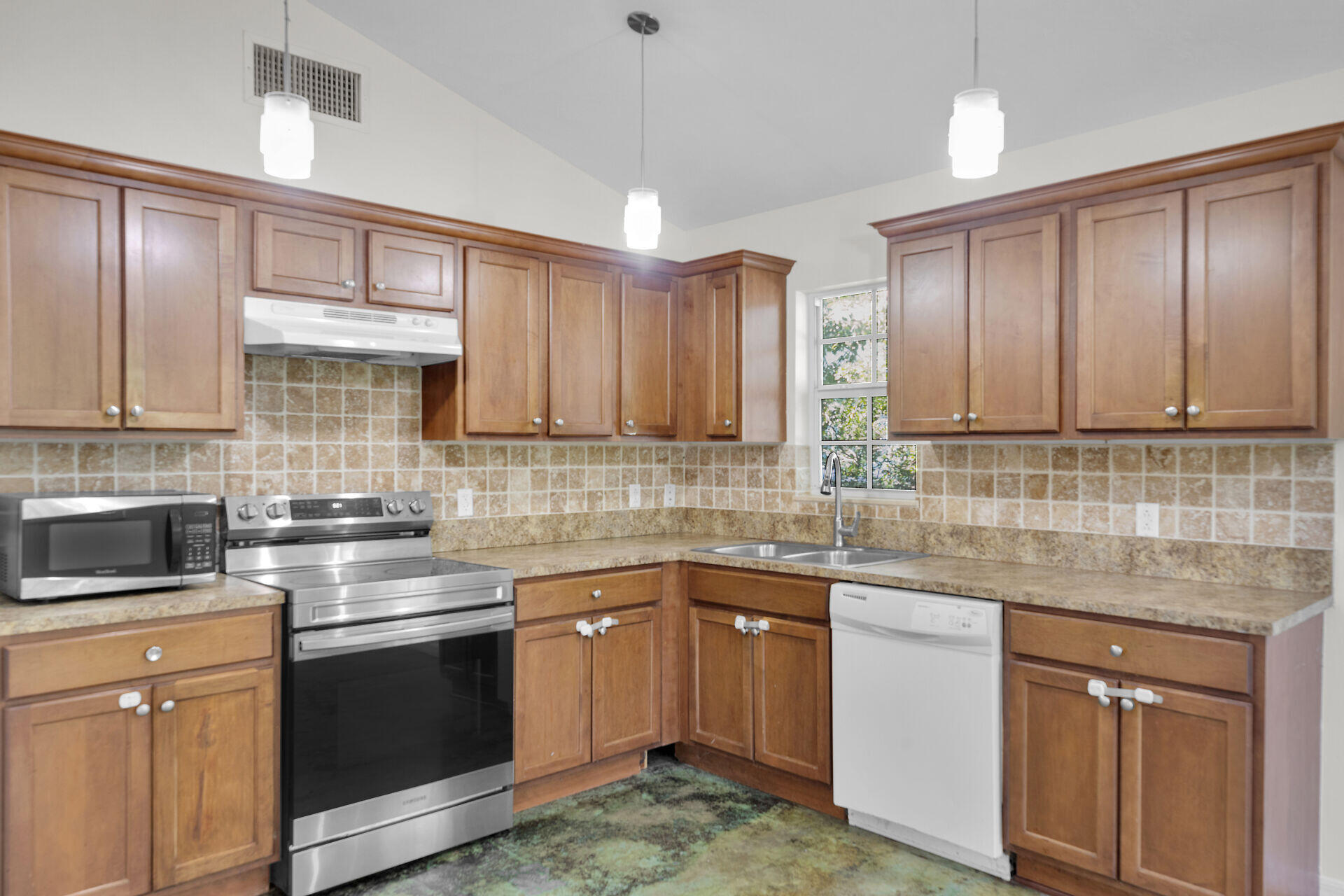 1018 Snapper Lane Key Largo, FL 33037 - Photo 13 of 24 a kitchen with stainless steel appliances granite countertop a sink stove cabinets and refrigerator