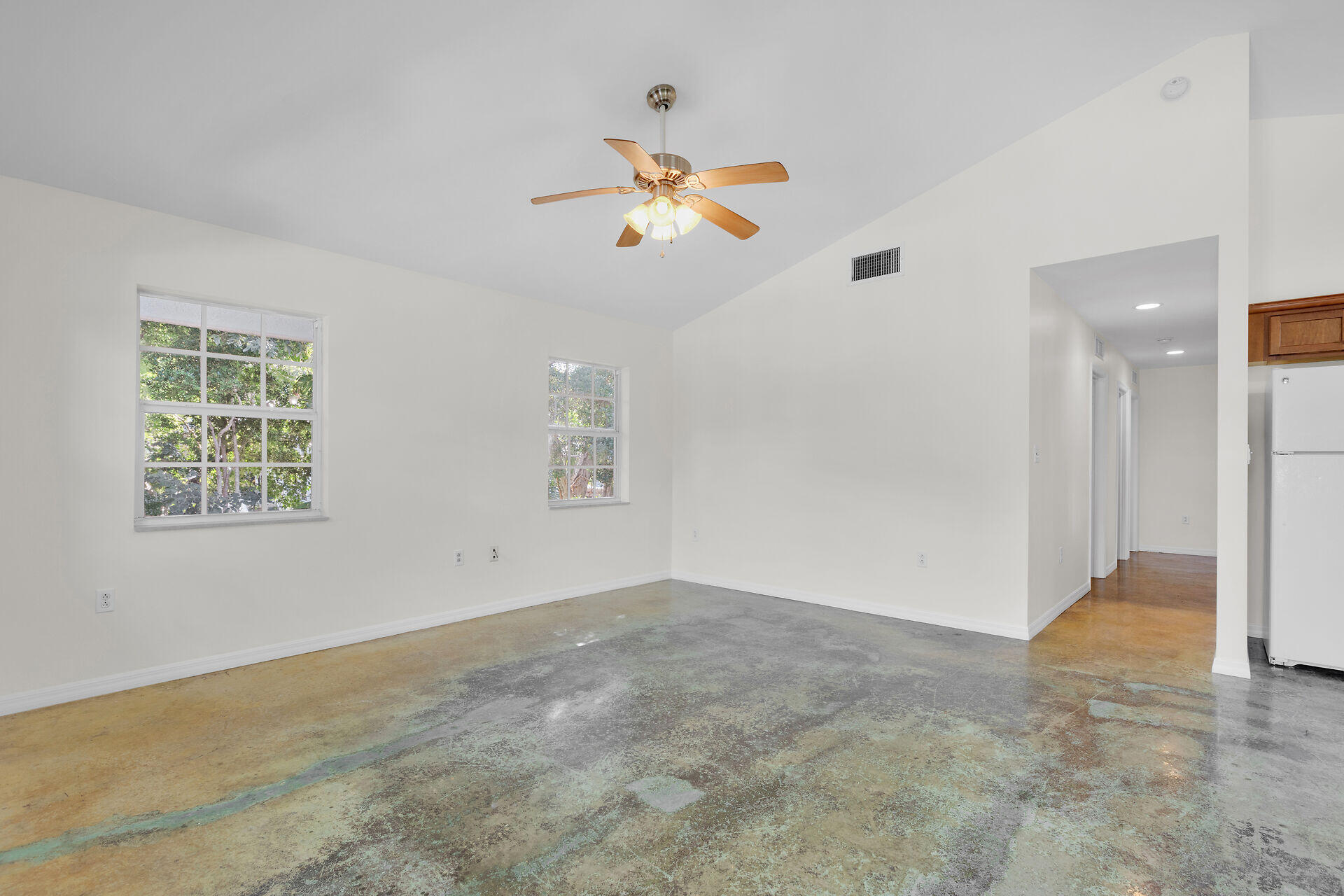 1018 Snapper Lane Key Largo, FL 33037 - Photo 15 of 24 an empty room with windows and fan