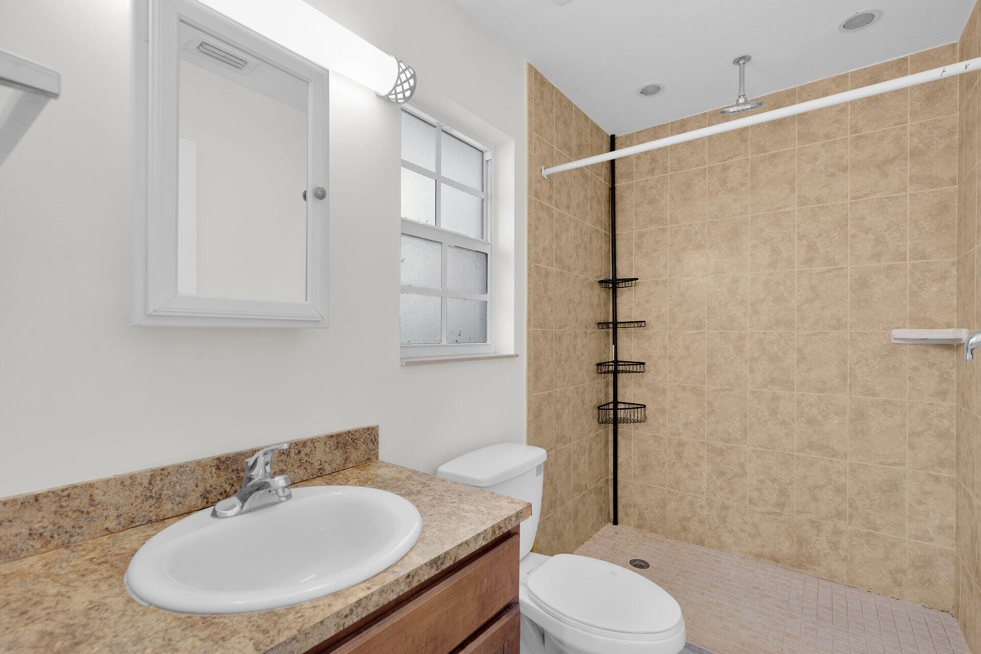 1018 Snapper Lane Key Largo, FL 33037 - Photo 2 of 24 a bathroom with a sink toilet and shower