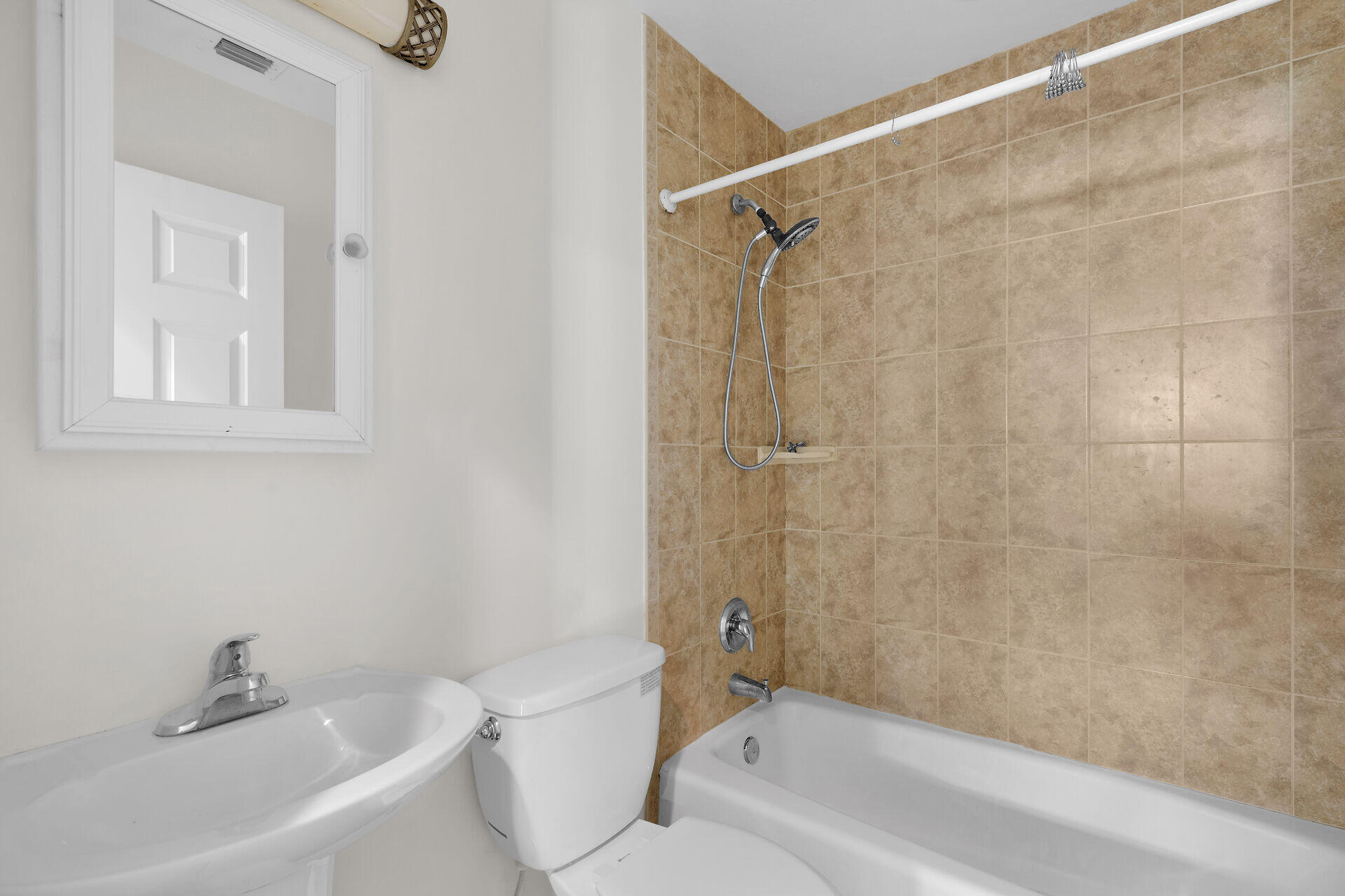 1018 Snapper Lane Key Largo, FL 33037 - Photo 3 of 24 a bathroom with a bathtub shower sink vanity and a toilet