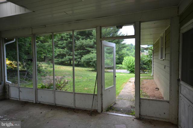 3326 Lineboro Road Manchester, MD 21102 - Photo 11 of 28 a view of a room with floor to ceiling windows and yard