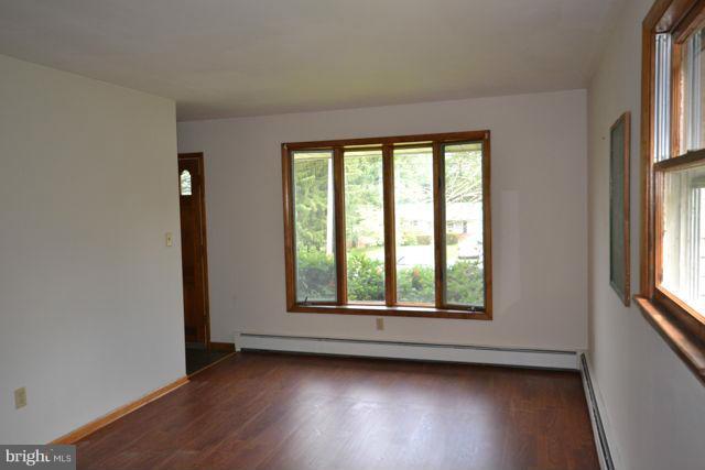 3326 Lineboro Road Manchester, MD 21102 - Photo 17 of 28 an empty room with wooden floor and windows