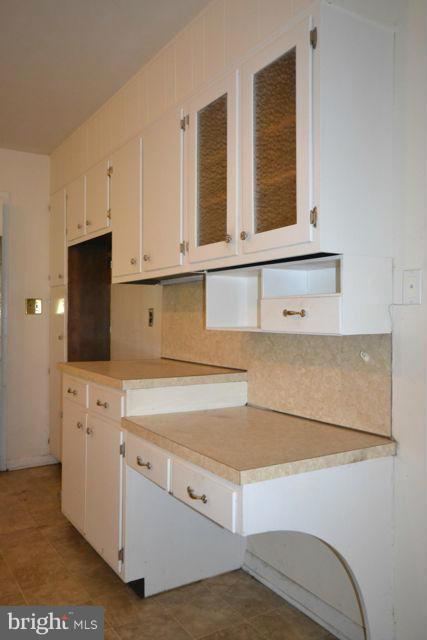 3326 Lineboro Road Manchester, MD 21102 - Photo 20 of 28 a kitchen with white cabinets and a sink