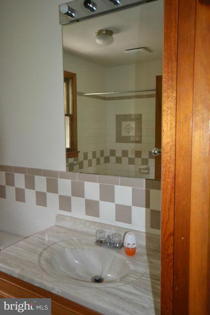 3326 Lineboro Road Manchester, MD 21102 - Photo 22 of 28 a bathroom with a sink and a mirror