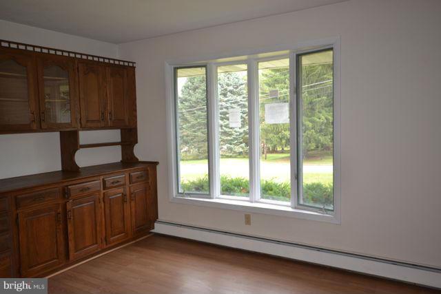 3326 Lineboro Road Manchester, MD 21102 - Photo 23 of 28 a kitchen with stainless steel appliances wooden cabinets a stove and a window