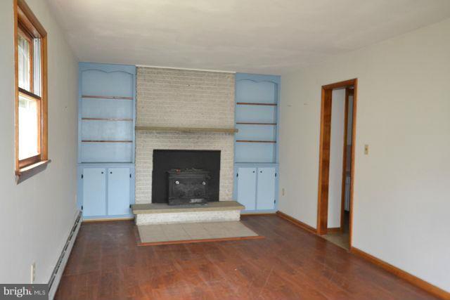 3326 Lineboro Road Manchester, MD 21102 - Photo 24 of 28 a view of a livingroom with a fireplace and window
