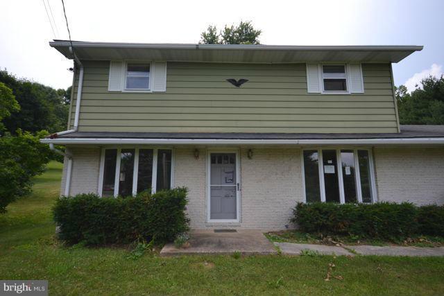 3326 Lineboro Road Manchester, MD 21102 - Photo 6 of 28 a front view of a house with a yard