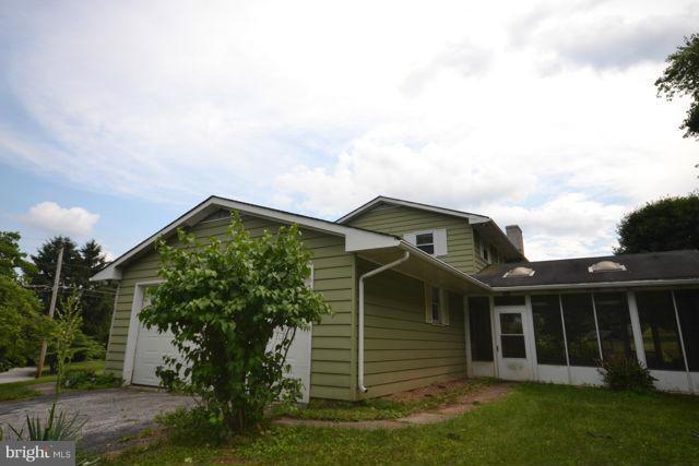 3326 Lineboro Road Manchester, MD 21102 - Photo 10 of 28 a front view of a house with a garden