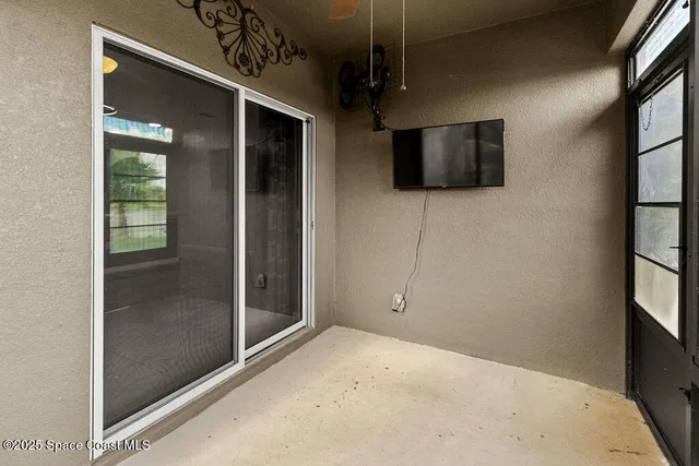 a view of a livingroom with a flat screen tv