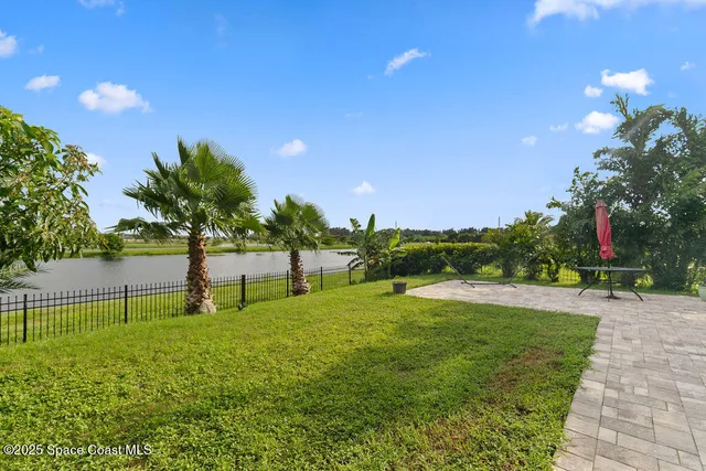 a view of pool with a yard