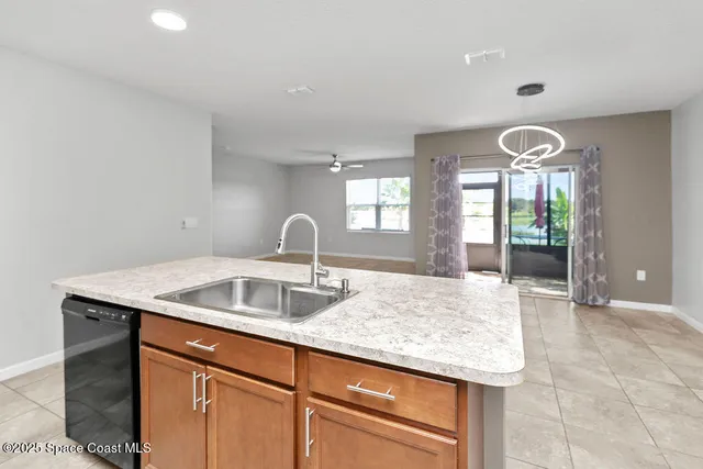 a kitchen with granite countertop a sink and a window