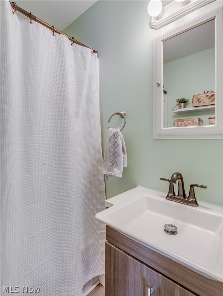 2700 Midvale Road Northwest Canton, OH 44708 - Photo 18 of 24 The bathroom has a new vanity and new flooring.