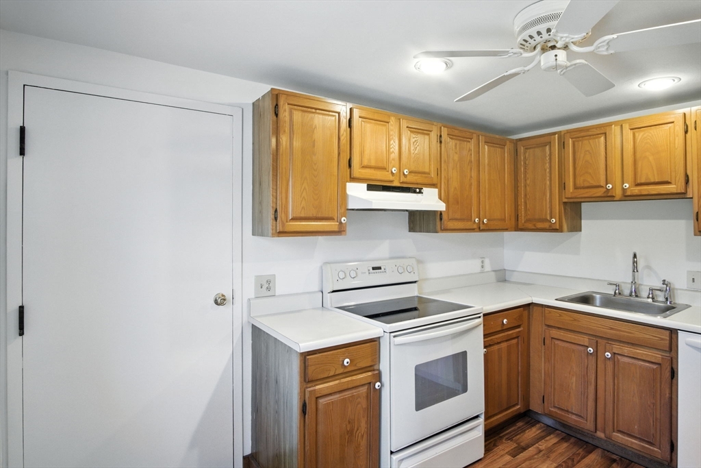8 Devlin Circle, Unit 8 Blackstone, MA 01504 - Photo 11 of 38 a kitchen with stainless steel appliances a stove a sink and cabinets