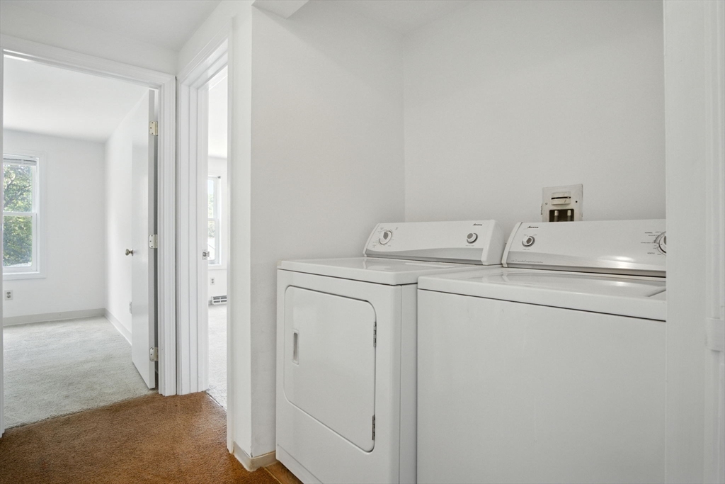 8 Devlin Circle, Unit 8 Blackstone, MA 01504 - Photo 16 of 38 a utility room with dryer and washer