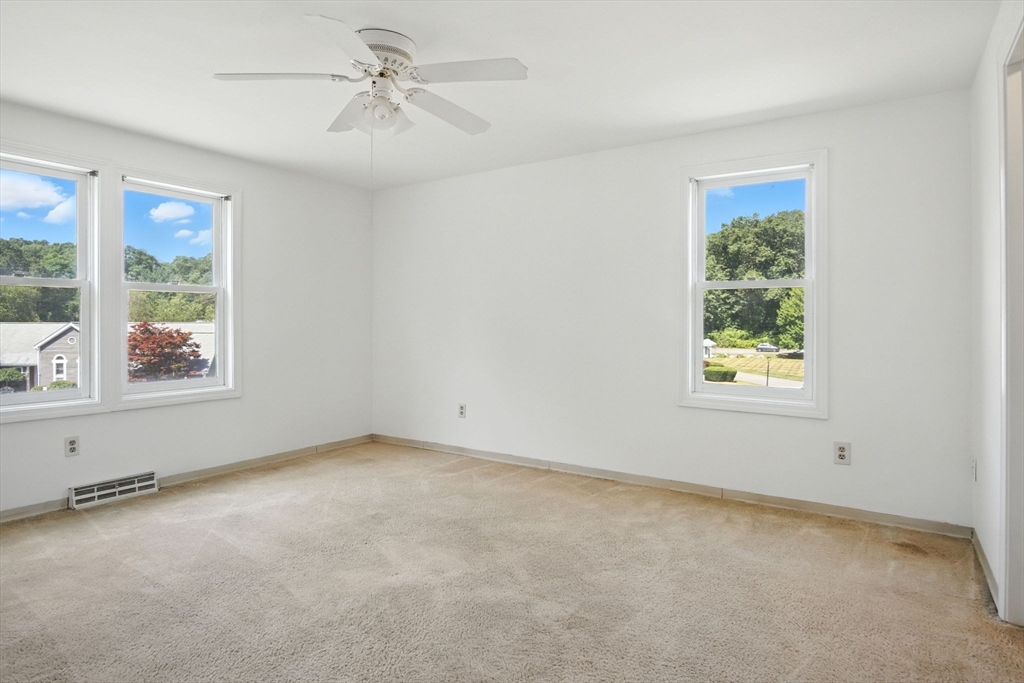 8 Devlin Circle, Unit 8 Blackstone, MA 01504 - Photo 17 of 38 a view of an empty room with a window