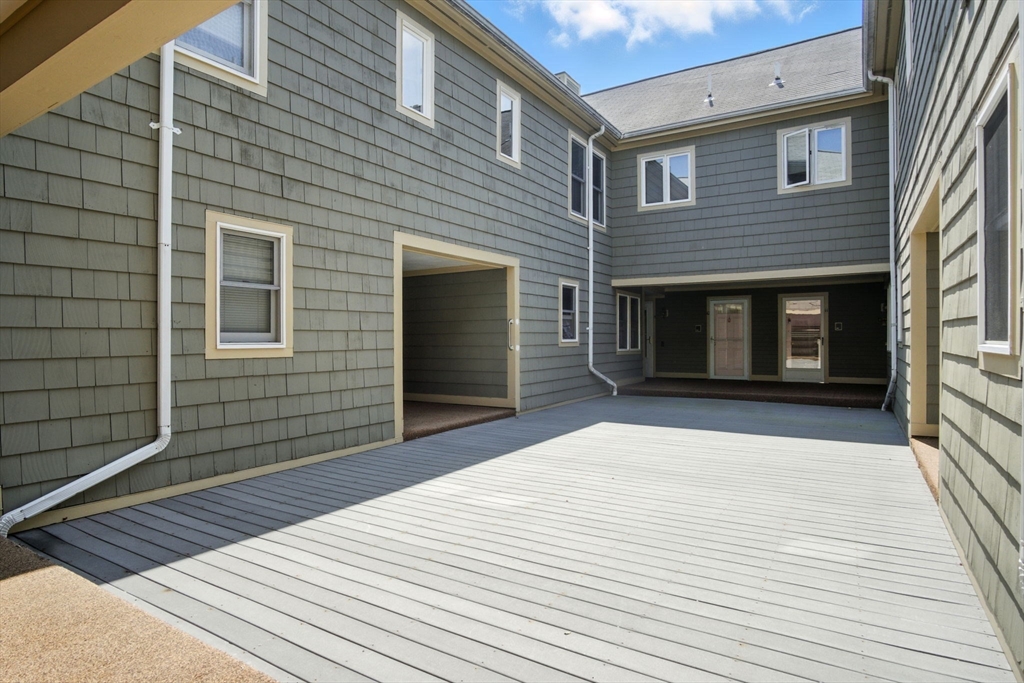 8 Devlin Circle, Unit 8 Blackstone, MA 01504 - Photo 2 of 38 a view of a house with a door and wooden floor