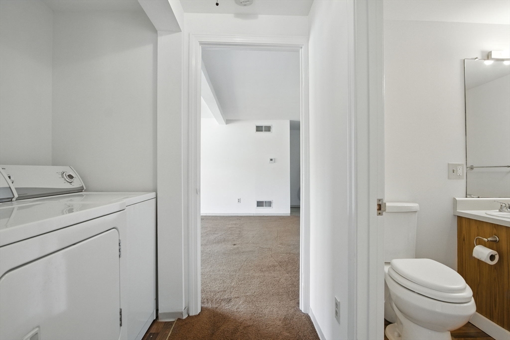 8 Devlin Circle, Unit 8 Blackstone, MA 01504 - Photo 23 of 38 a bathroom with a granite countertop sink toilet and shower