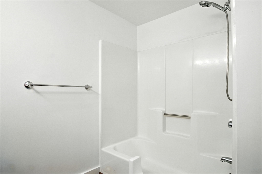 8 Devlin Circle, Unit 8 Blackstone, MA 01504 - Photo 26 of 38 a bathroom with a bathtub