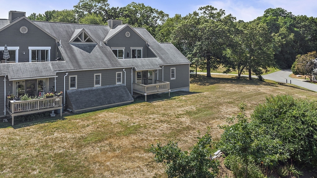 8 Devlin Circle, Unit 8 Blackstone, MA 01504 - Photo 28 of 38 a aerial view of a house with a yard and large trees