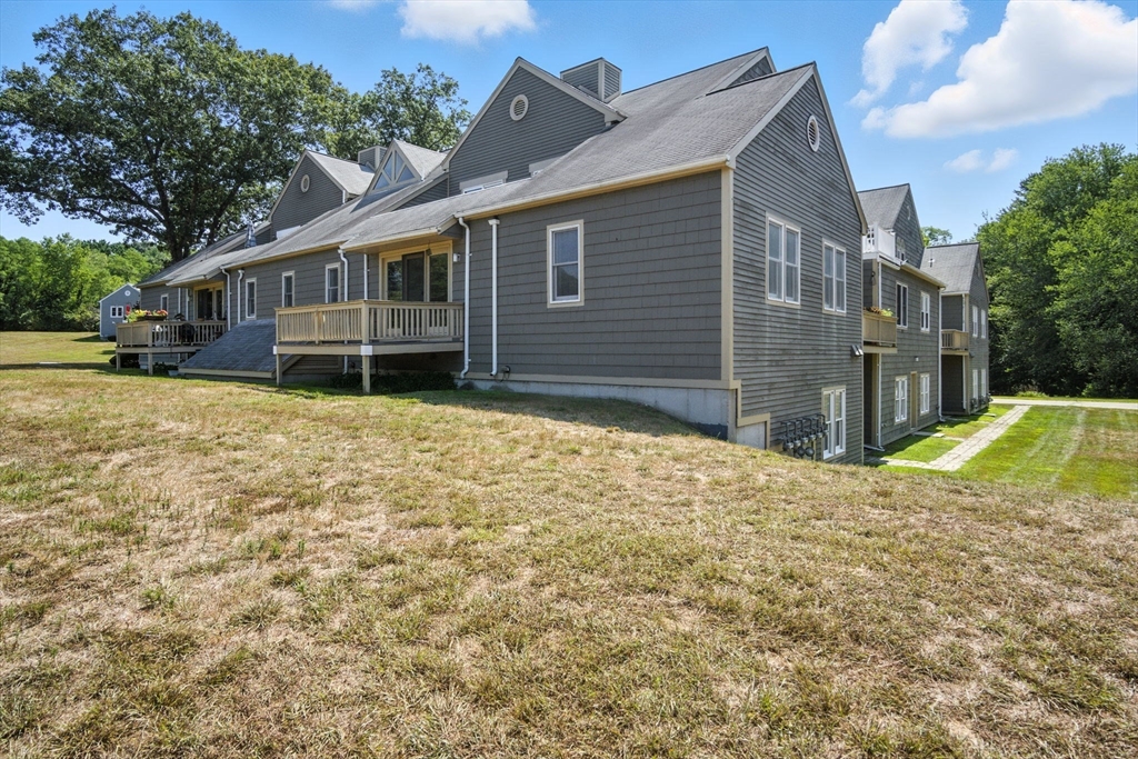 8 Devlin Circle, Unit 8 Blackstone, MA 01504 - Photo 30 of 38 a view of a house with a yard