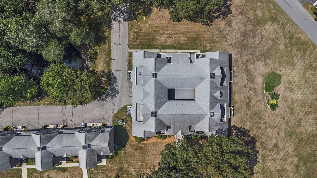 8 Devlin Circle, Unit 8 Blackstone, MA 01504 - Photo 31 of 38 an aerial view of a house with outdoor space