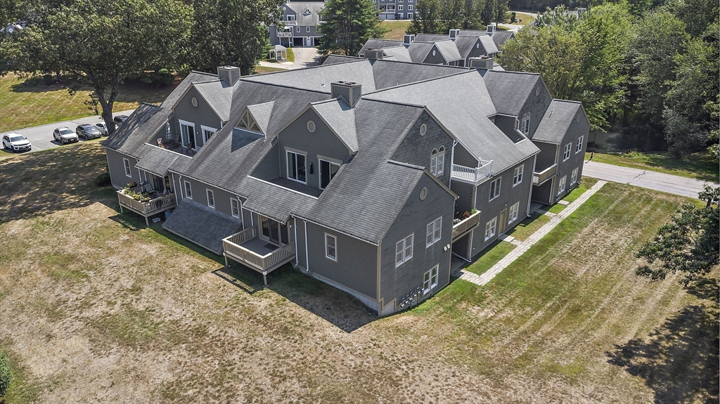 8 Devlin Circle, Unit 8 Blackstone, MA 01504 - Photo 32 of 38 an aerial view of a house with a yard swimming pool and outdoor seating