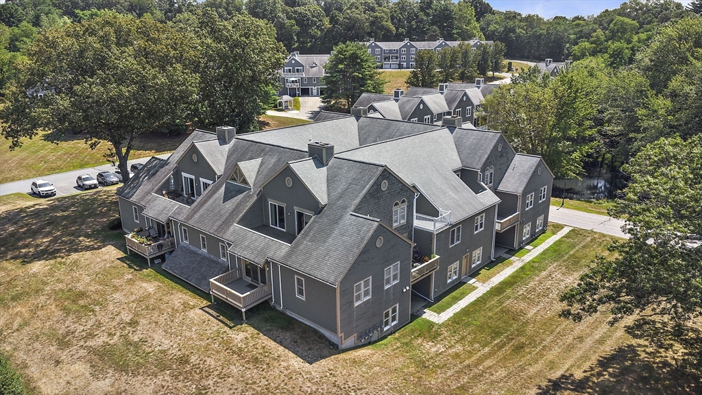 8 Devlin Circle, Unit 8 Blackstone, MA 01504 - Photo 34 of 38 an aerial view of a house with outdoor space and sitting area