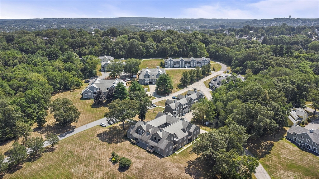 8 Devlin Circle, Unit 8 Blackstone, MA 01504 - Photo 35 of 38 an aerial view of a house with a yard