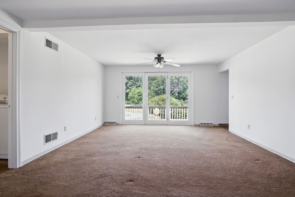 8 Devlin Circle, Unit 8 Blackstone, MA 01504 - Photo 6 of 38 a view of an empty room with a window