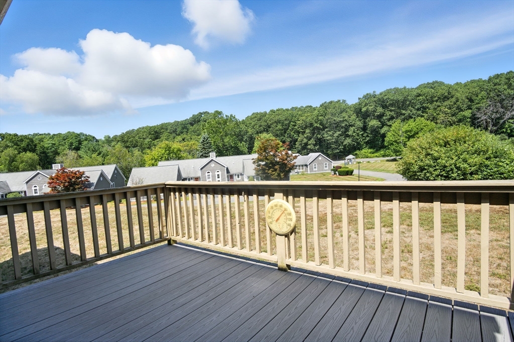 8 Devlin Circle, Unit 8 Blackstone, MA 01504 - Photo 9 of 38 a view of balcony with wooden floor