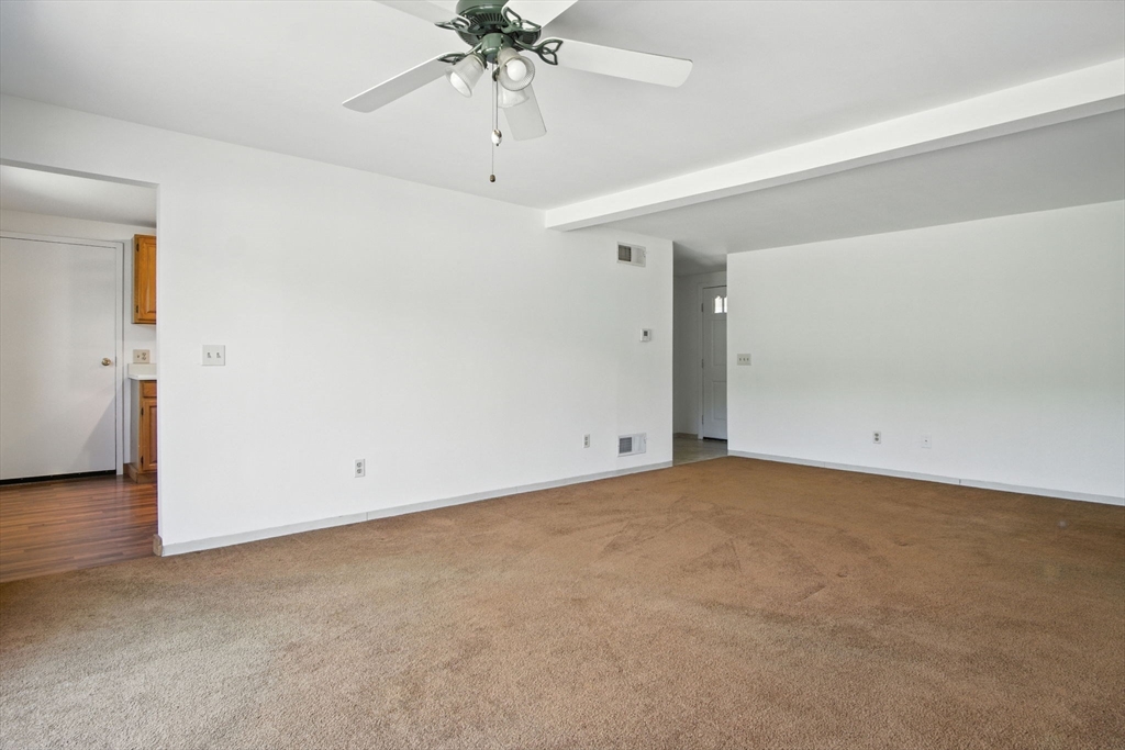 8 Devlin Circle, Unit 8 Blackstone, MA 01504 - Photo 10 of 38 an empty room with a view of a room