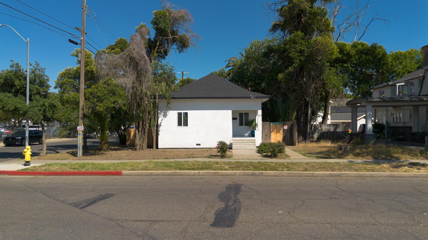 2320 K Street Merced, CA 95340 - Photo 2 of 25 a house with yard in front of it
