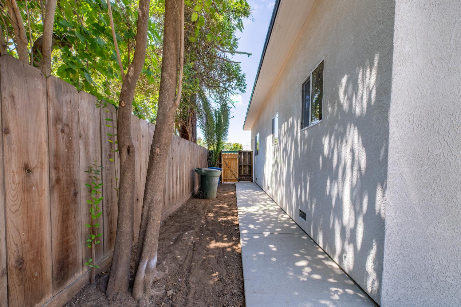 2320 K Street Merced, CA 95340 - Photo 21 of 25 a view of a back yard from a corridor